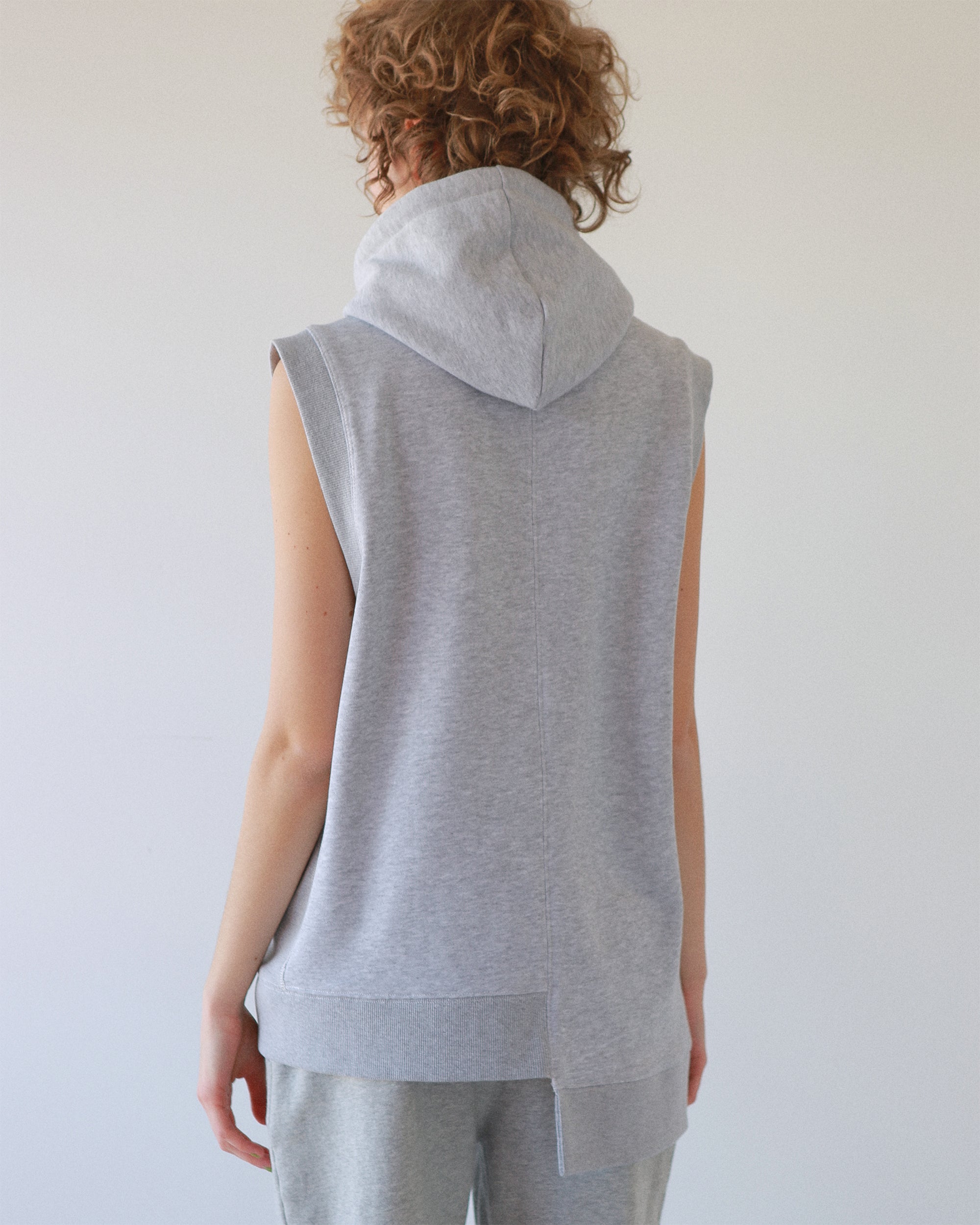 Flocky asymmetric hoodie vest